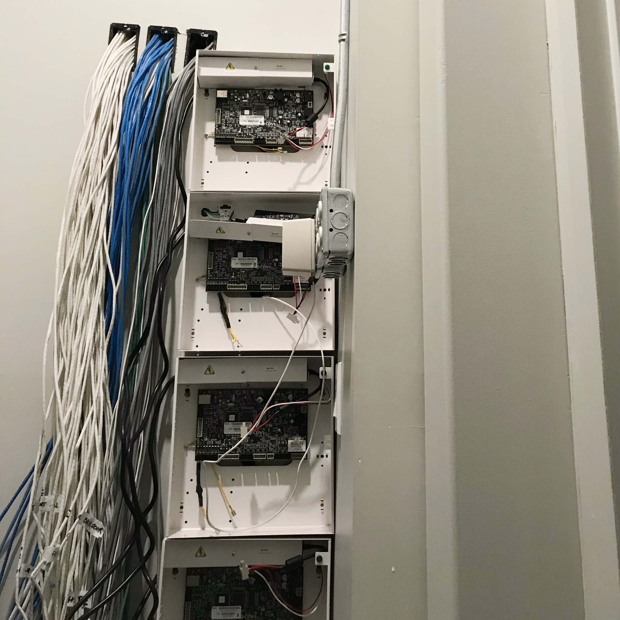 Commercial security control panels with bundled network and low-voltage cables
