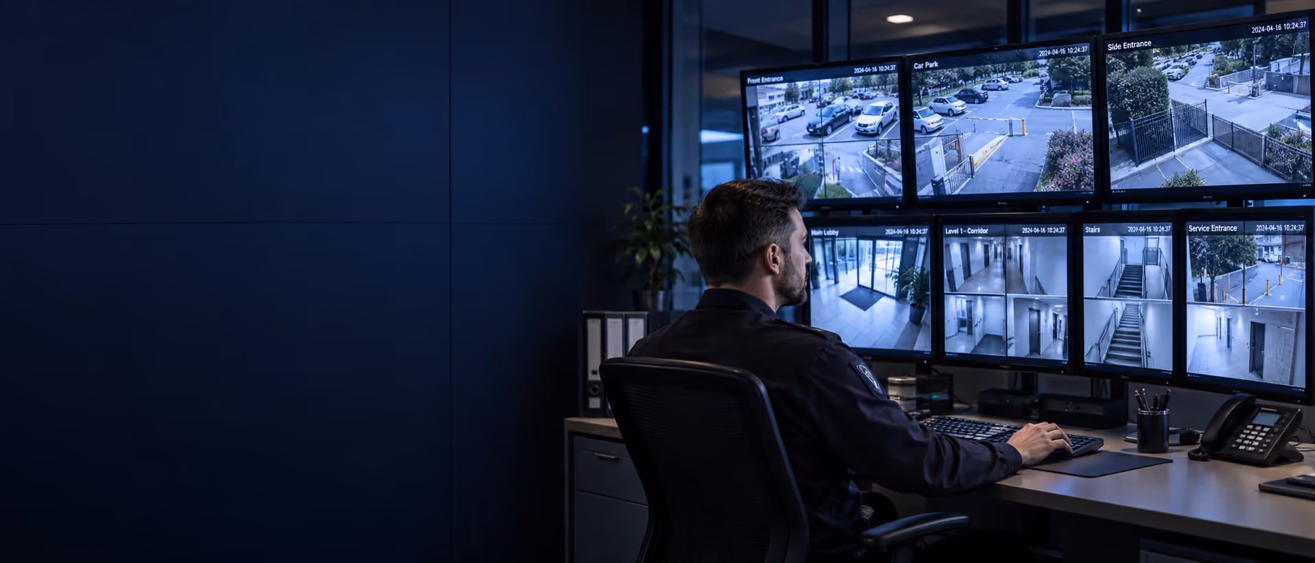 Home alarm monitoring operator watching security screens