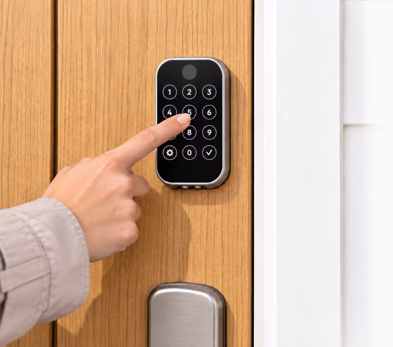 Finger entering a code on a smart lock keypad