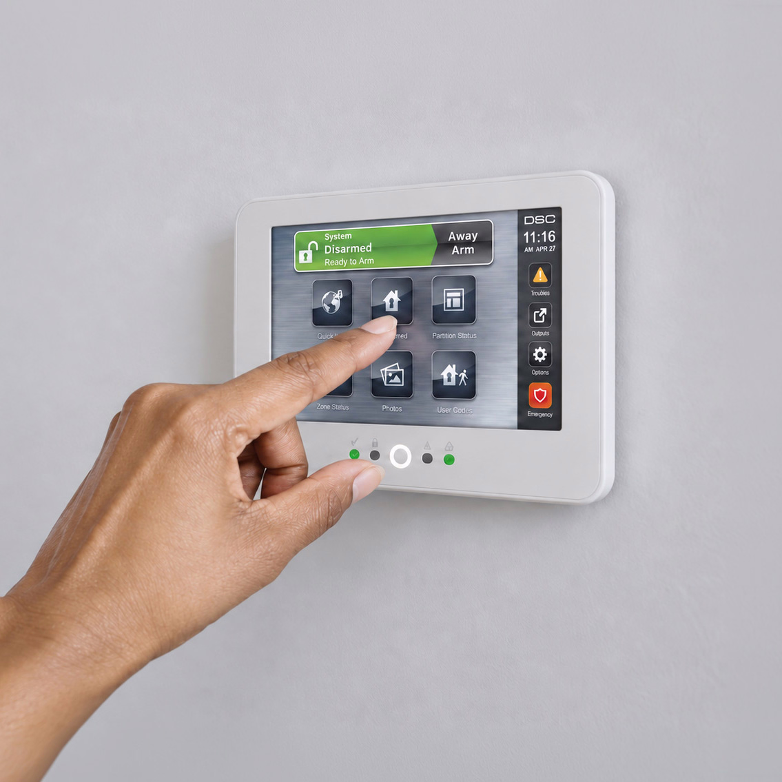 Hand using a touchscreen alarm keypad